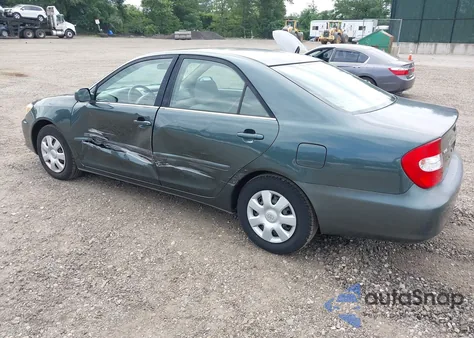 2003 Toyota Camry Le z USA, uszkodzony, nr VIN 4T1BE32K03U227823